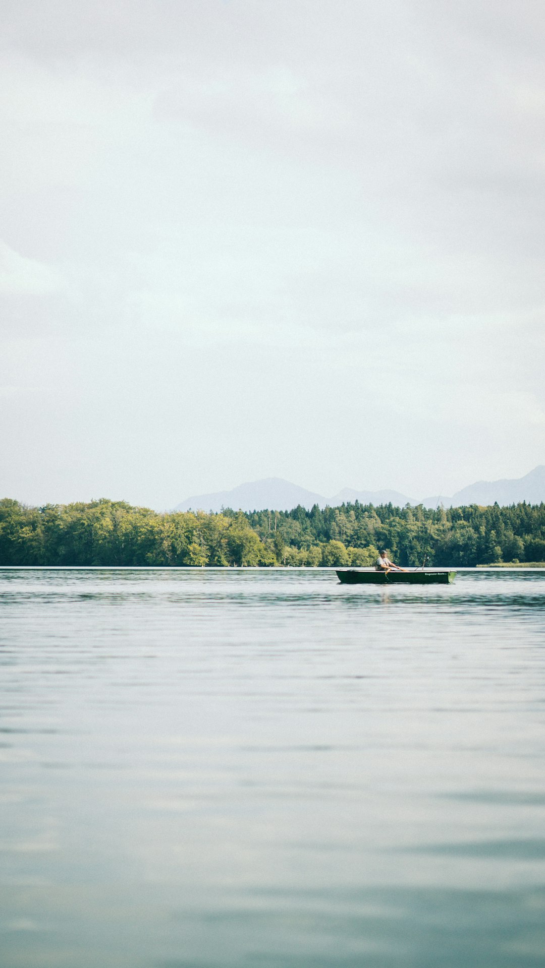 person riding canoe during daytime