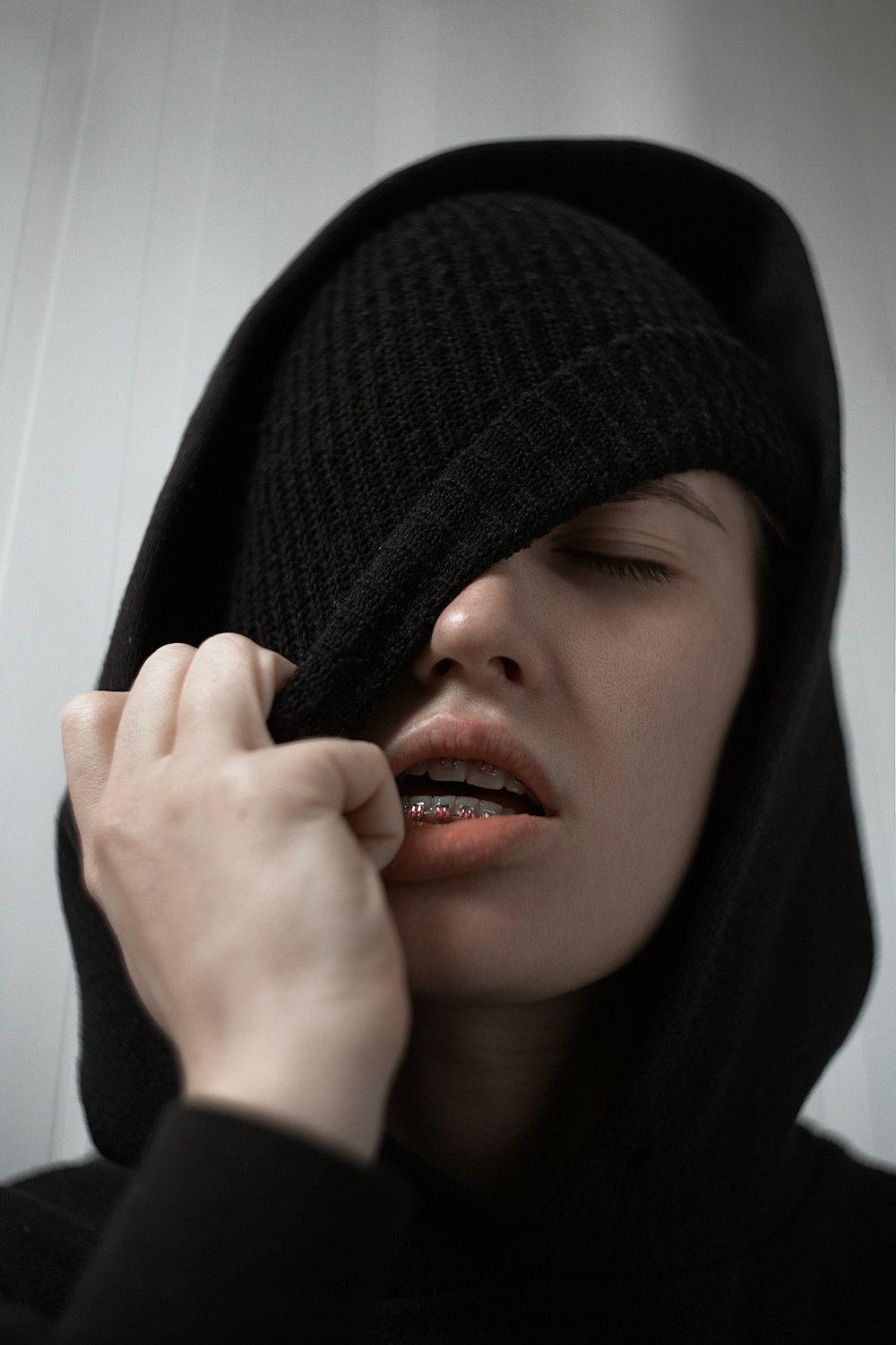 woman wearing black hood