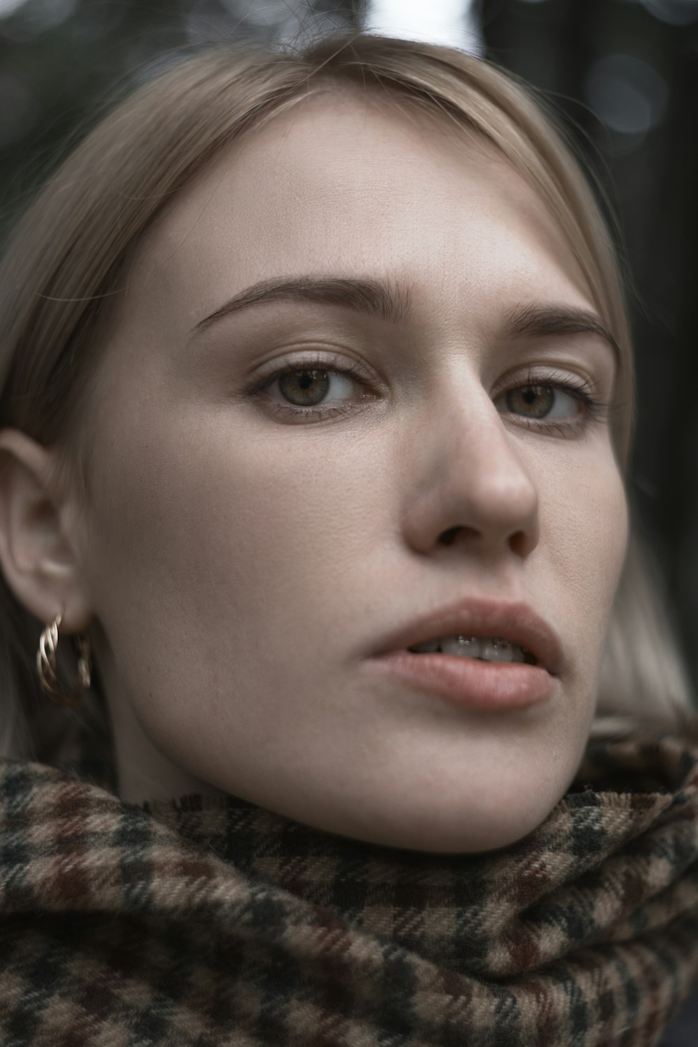 shallow focus photo of woman in brown and black top