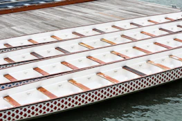 Secretary Dinesh Munde coordinating a lively dragon boat training session.