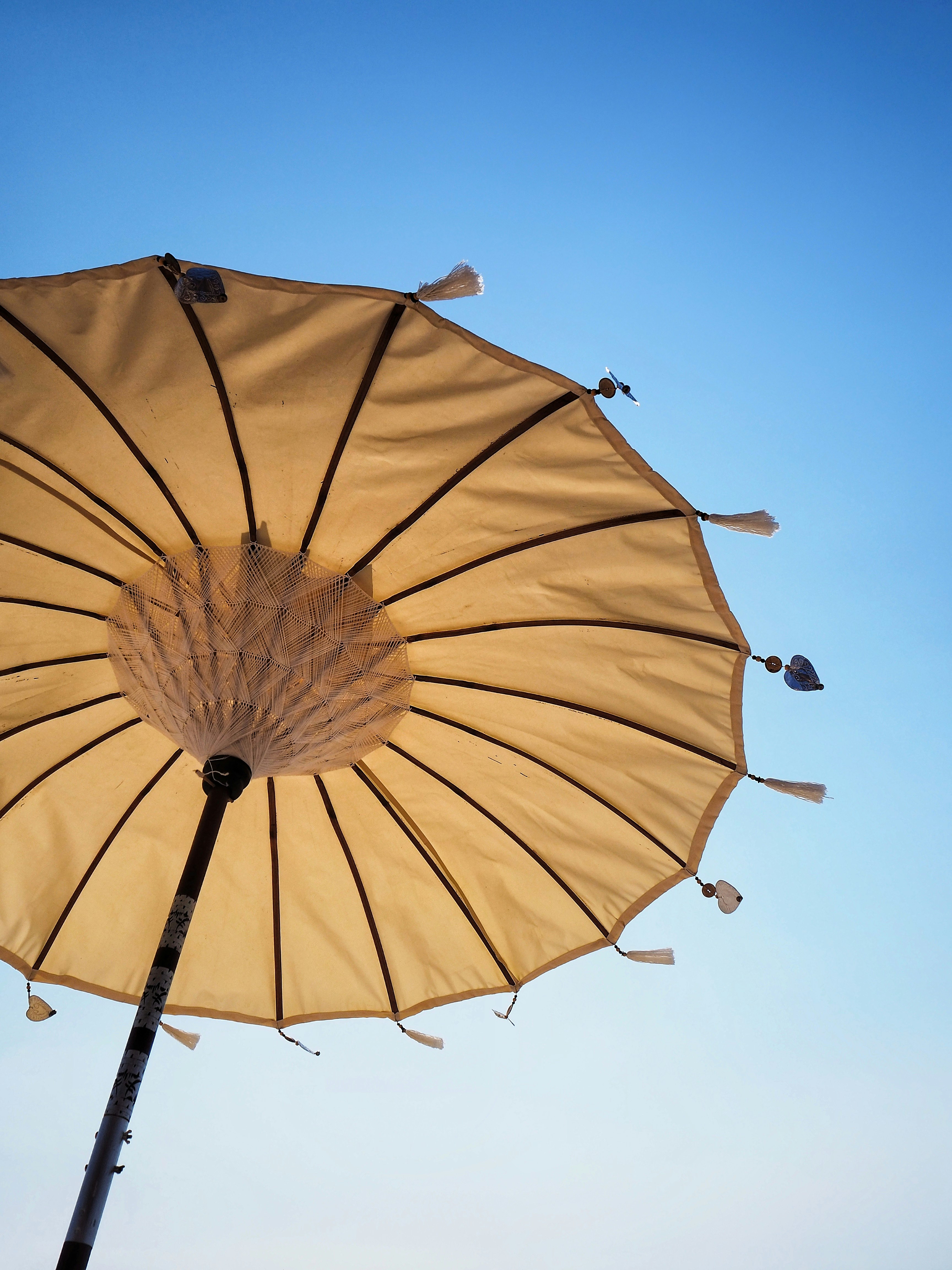 shallow focus photo of brown off-set umbrella