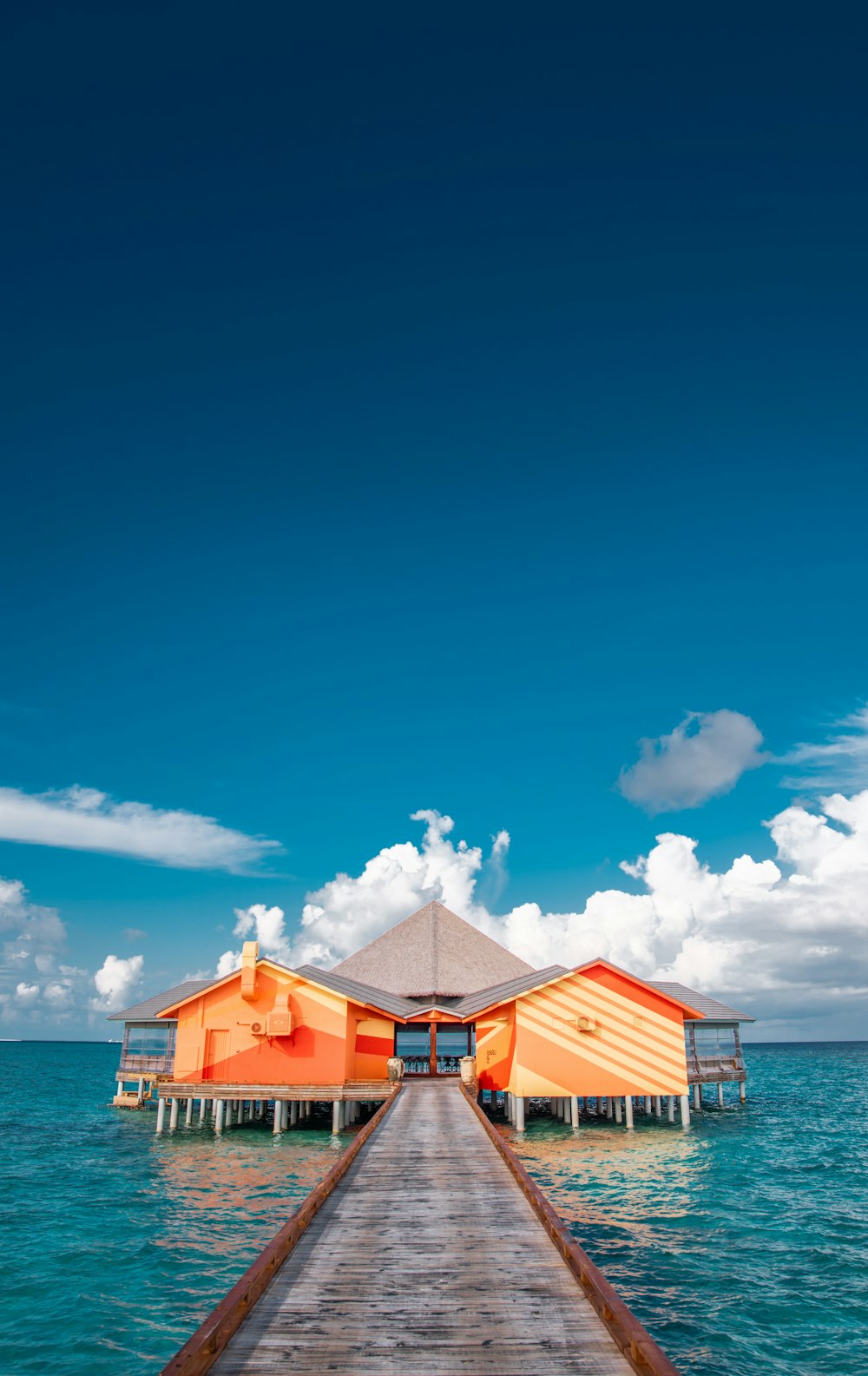 red-and-white wooden sea cottages during daytime 3