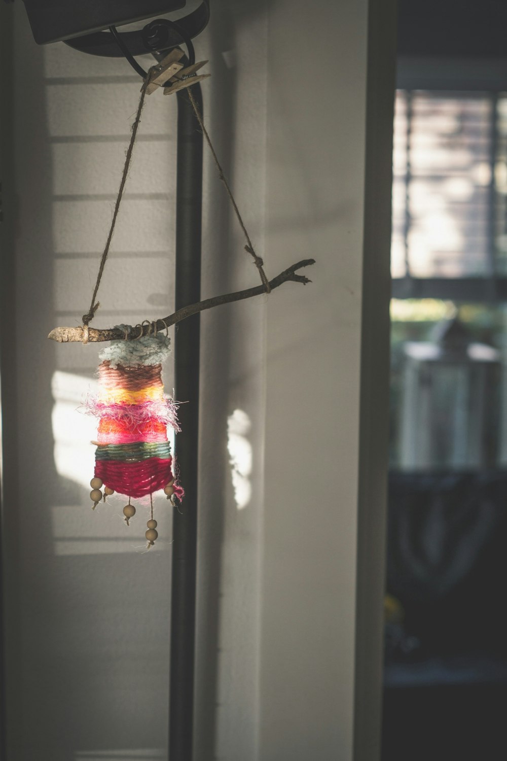 selective focus photography of hanging decor in front of door