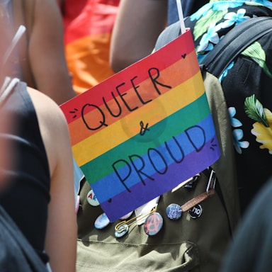 selective-focus of photography of Queer & Proud signage