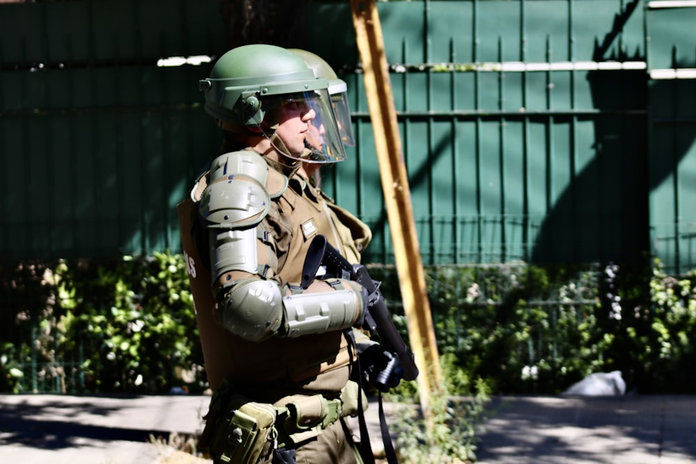 man with helmet walking on focus photography