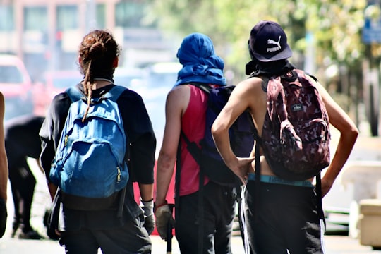 three person standing with backpacks in Santiago de Chile Chile