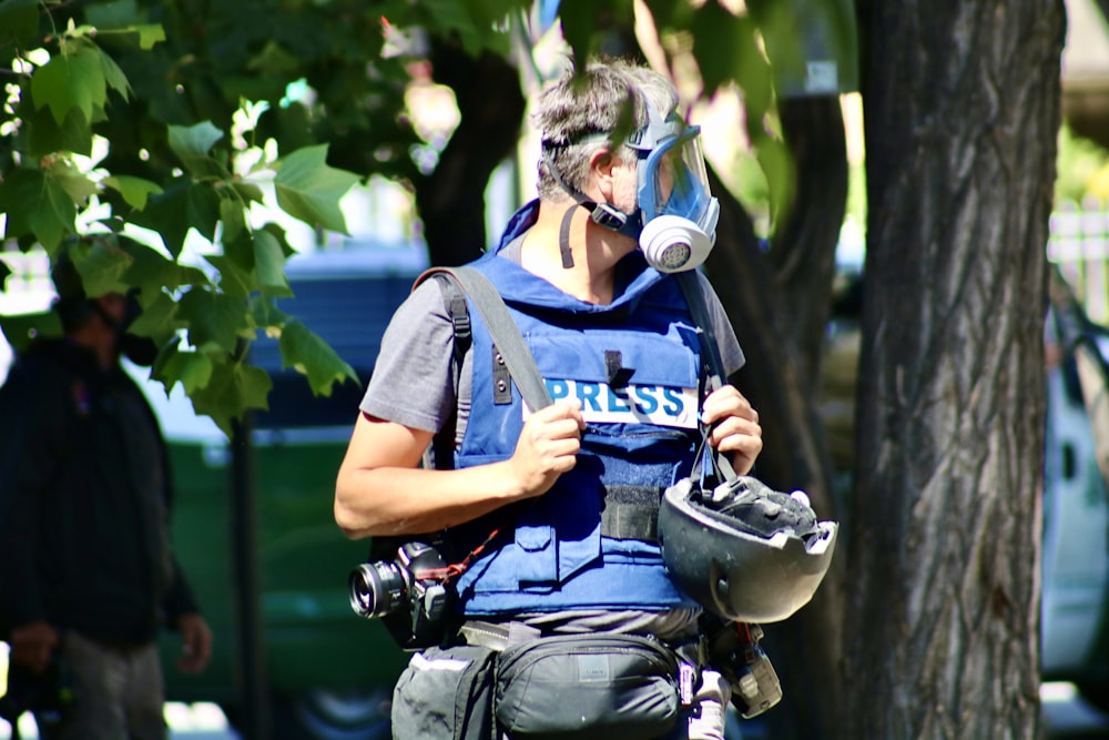 cop walking near tree