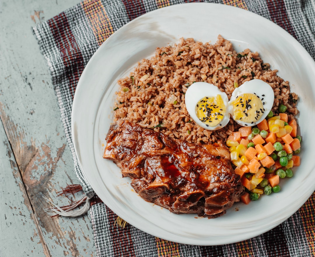 shallow focus photo of boiled eggs on brown rice