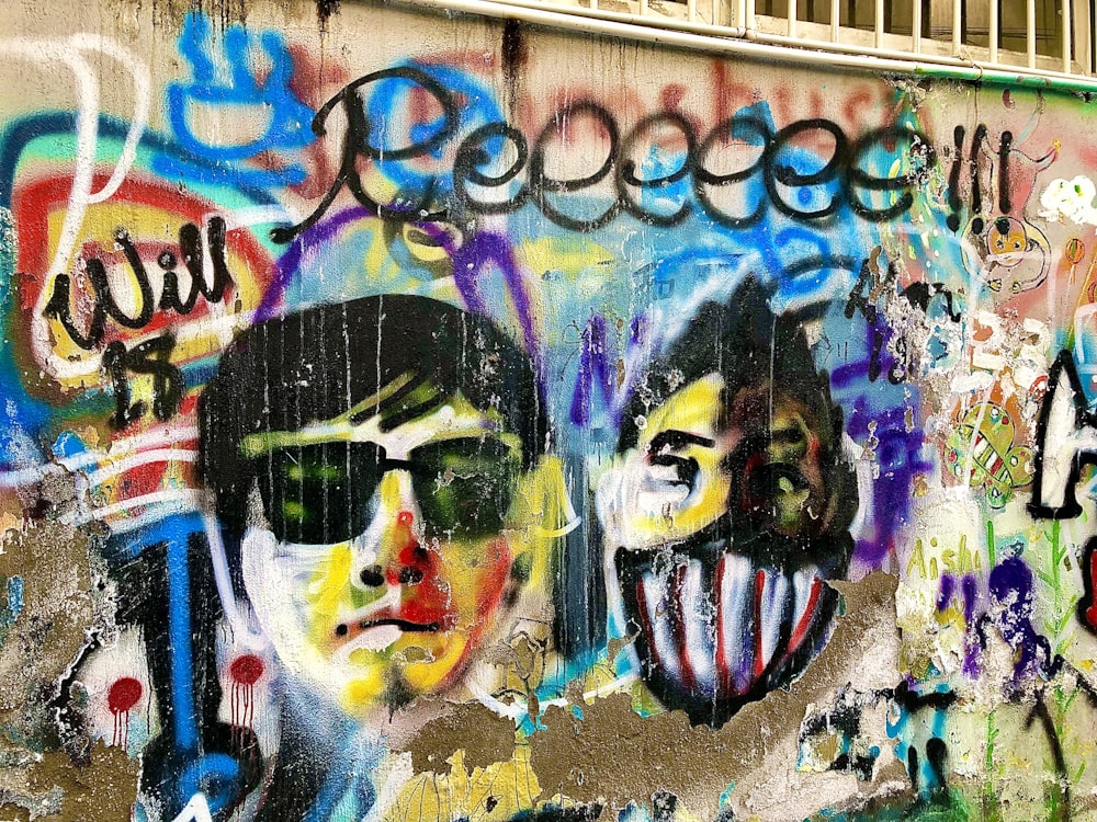 man wearing sunglasses graffiti