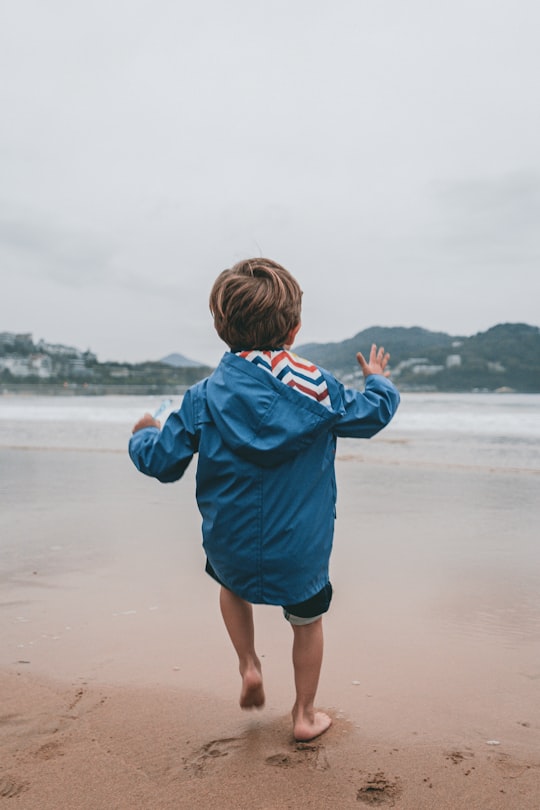 toddler in blue hoodie in San Sebastián Spain