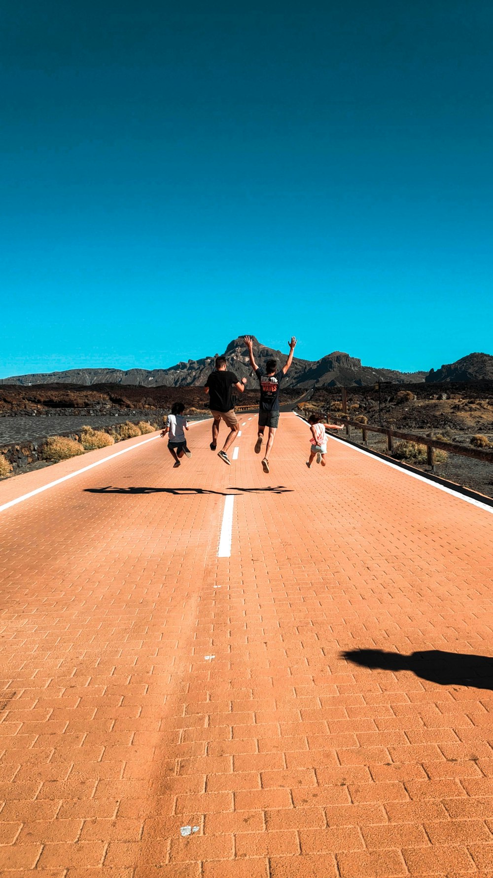 people standing on road