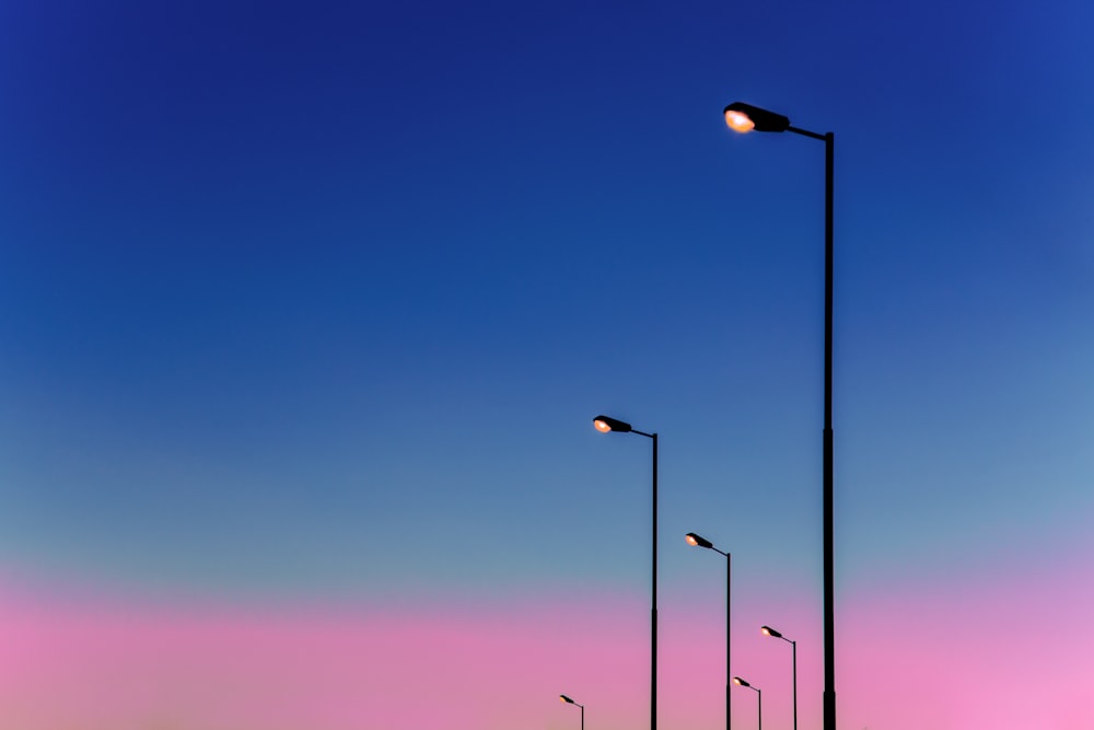 black metal light post during night time