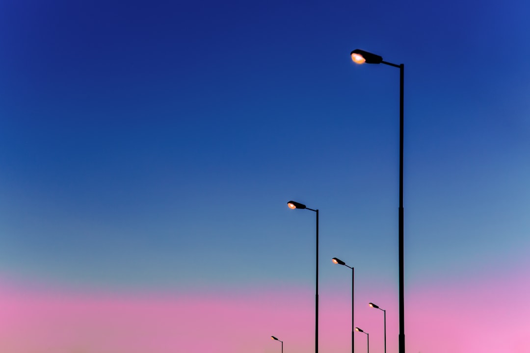 black metal light post during night time