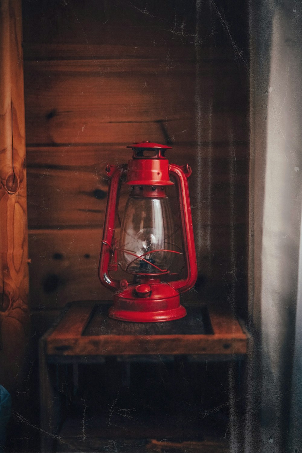 red lantern lamp on brown wooden table