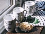 An elegant collection of personalized mugs with charming handwritten messages.