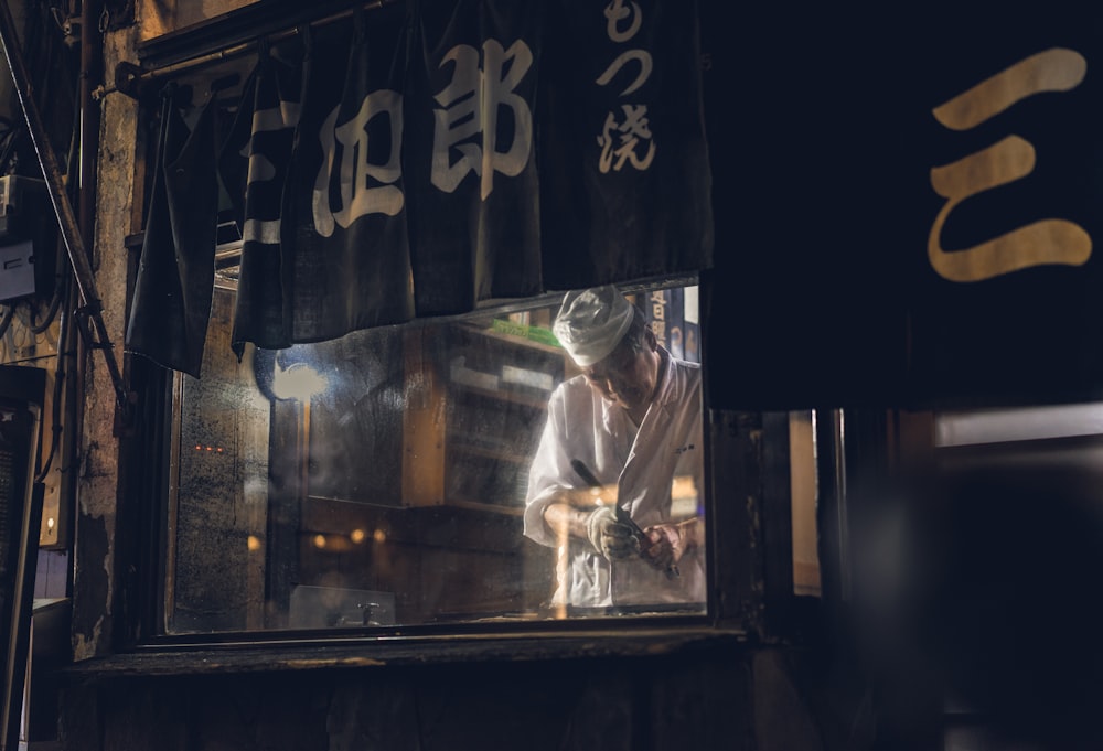 chef standing in front of glass wall