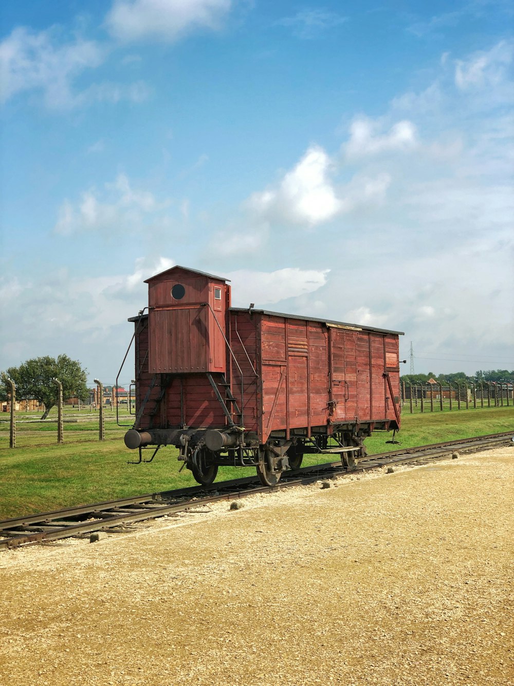 brown train near trees during daytime