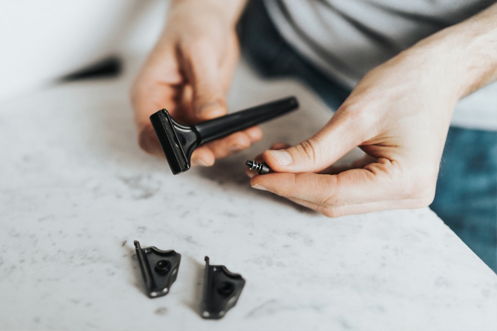 person standing while fixing shaver