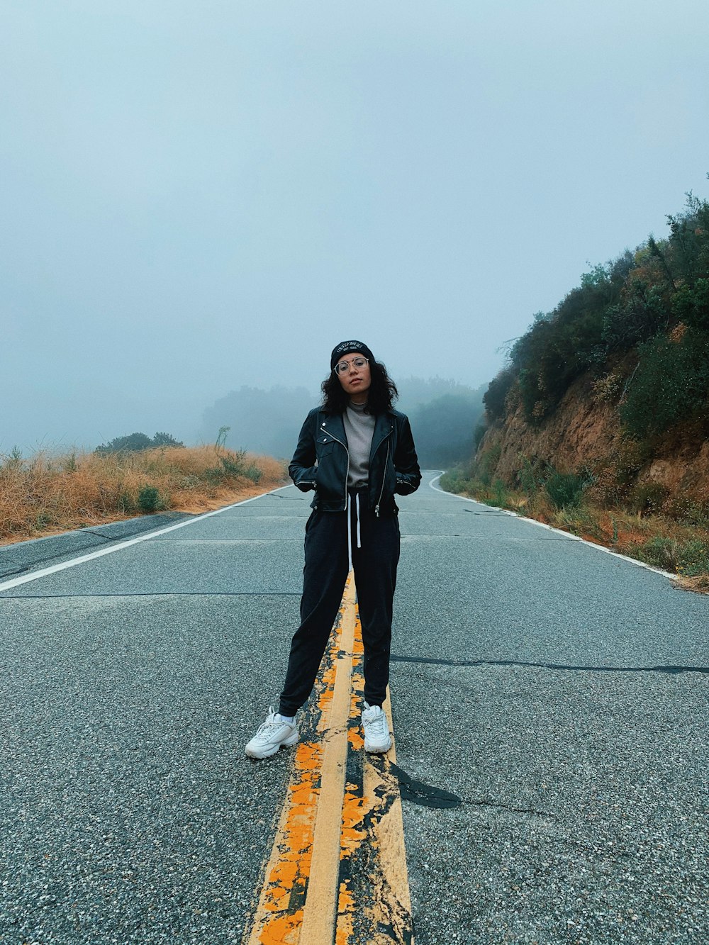 woman standing on road