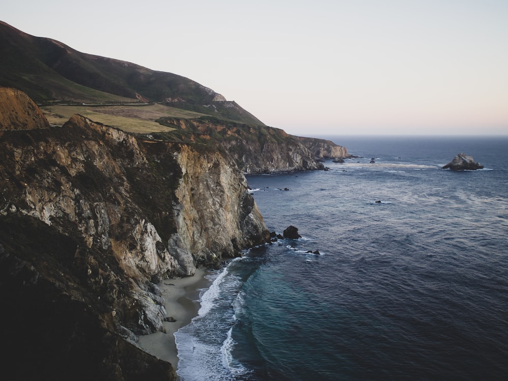 ocean under cloudy sky