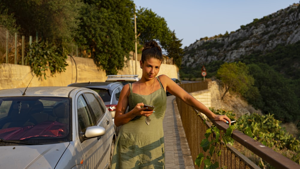 shallow focus photo of woman in green thick strap dress