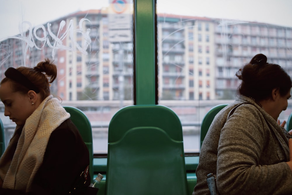 woman sitting inside gray vehicle seat