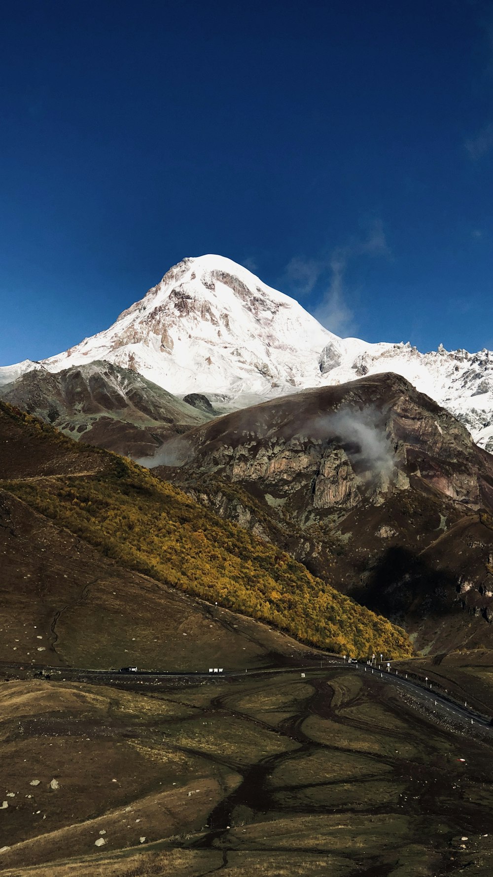 snow covered mountain during daytime