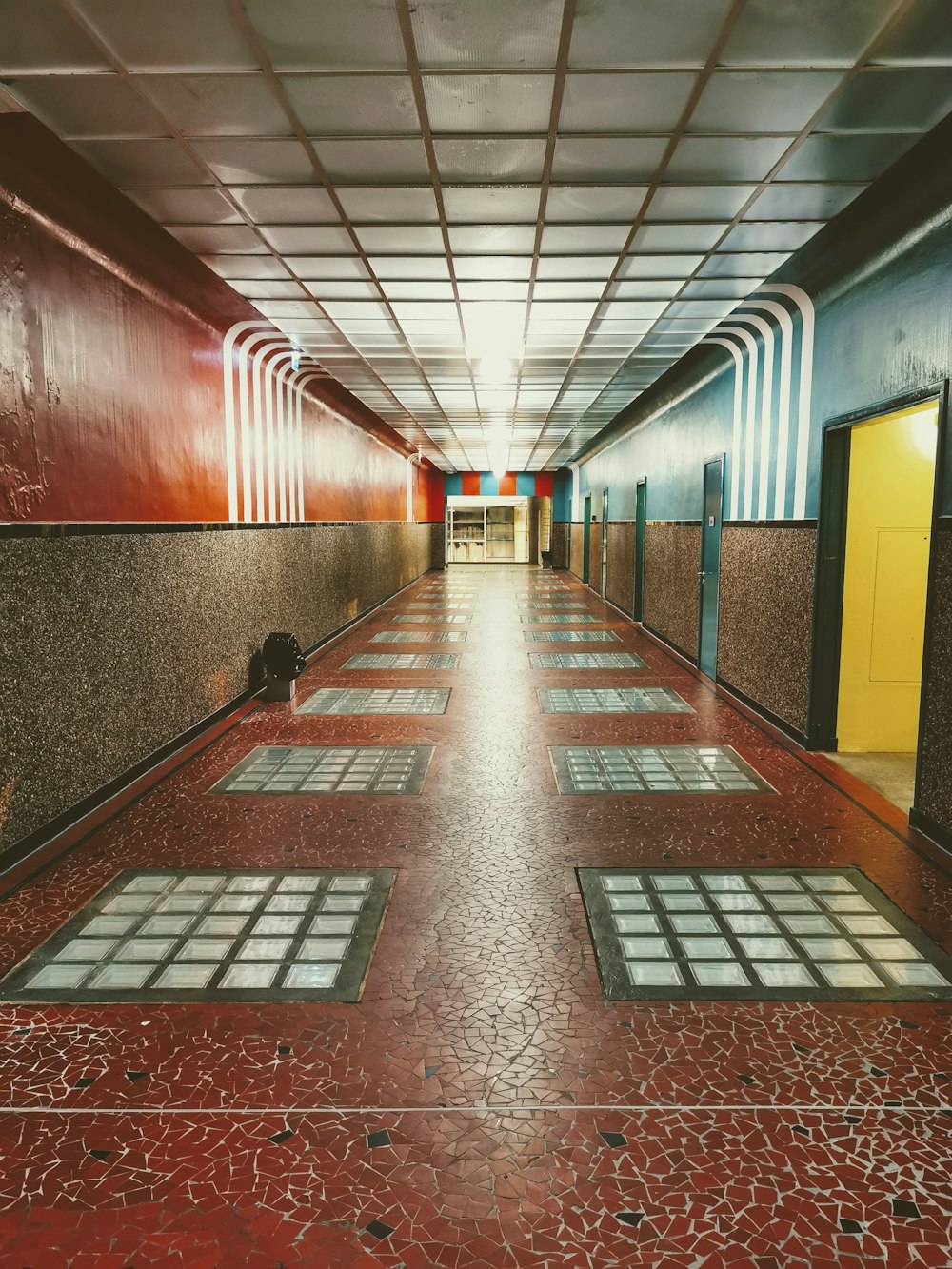 a long hallway with tiled floors and walls