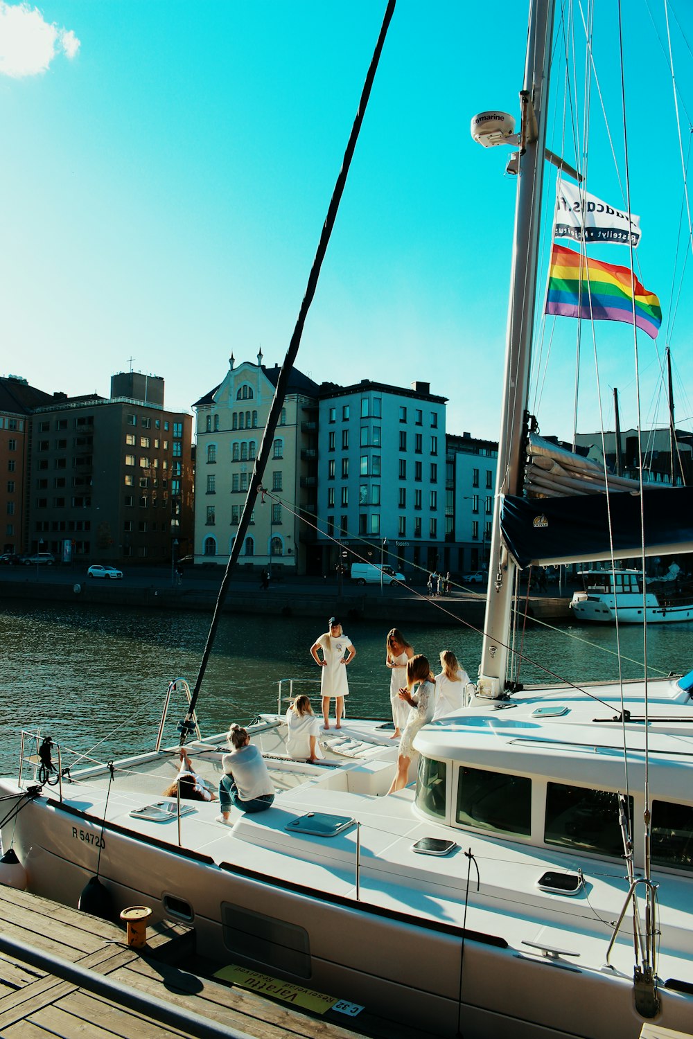 people standing on yacht