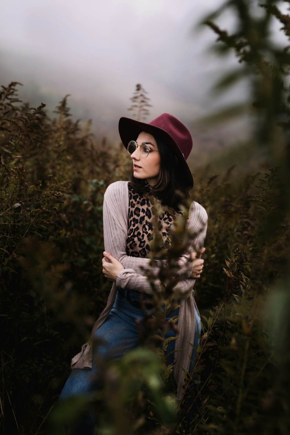 woman standing in plants during daytime