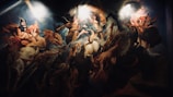 A dramatic and dynamic painting featuring a mythological scene with multiple figures and divine beings in motion. There are armored warriors, ethereal women, and horses, all enveloped in swirling clouds and light. The central figure appears to be the focus of divine attention, surrounded by celestial beings.