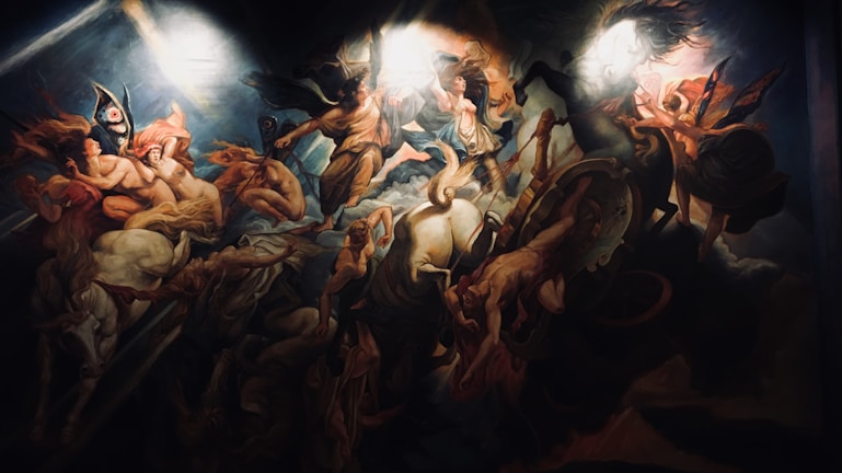 A dramatic and dynamic painting featuring a mythological scene with multiple figures and divine beings in motion. There are armored warriors, ethereal women, and horses, all enveloped in swirling clouds and light. The central figure appears to be the focus of divine attention, surrounded by celestial beings.
