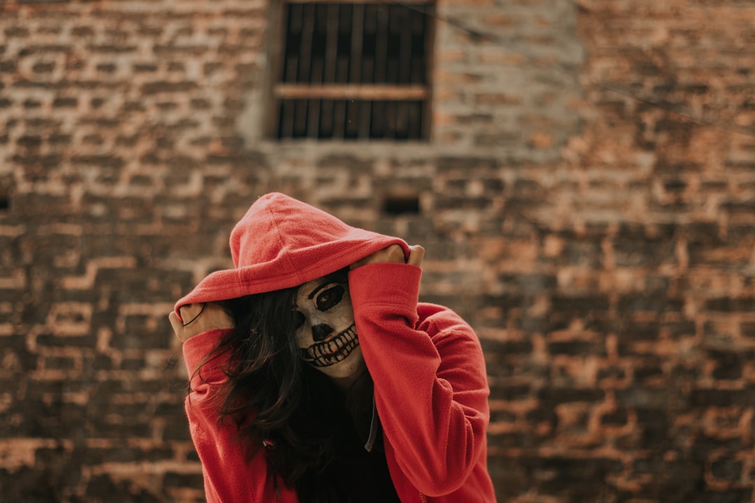man in red pullover jacket,