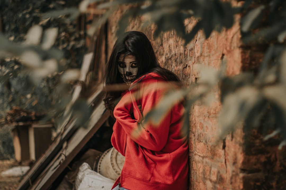 woman in red zip-up jacket