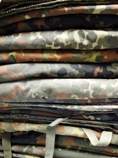 Stacks of waterproof and rot-proof cotton canvas cloth rolls in olive green ready for export