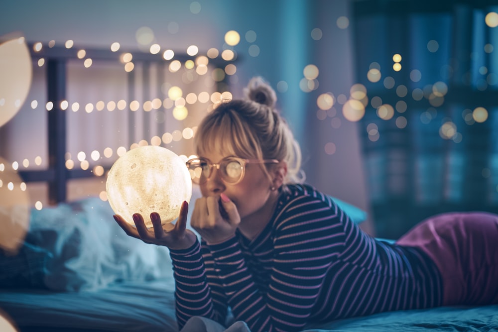 pruning woman holding globe