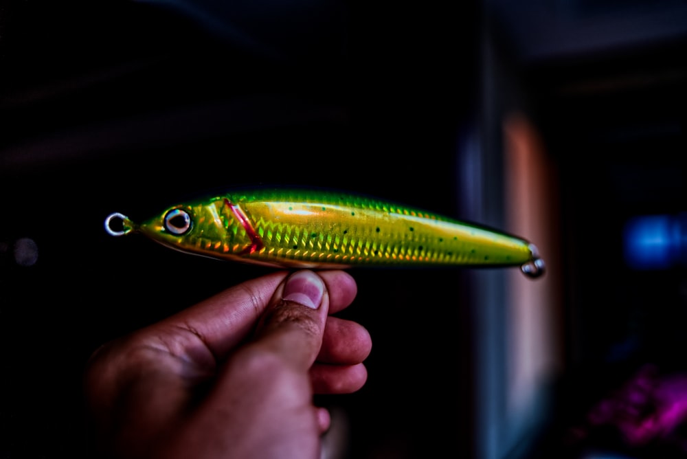green and brown fish lure