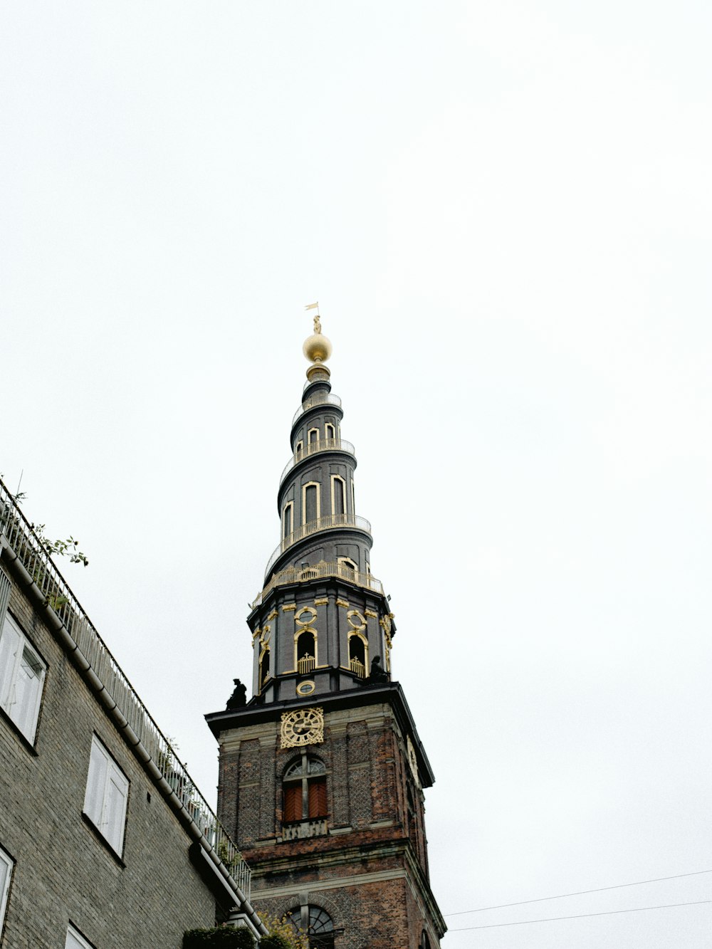 a tall tower with a clock on it's side