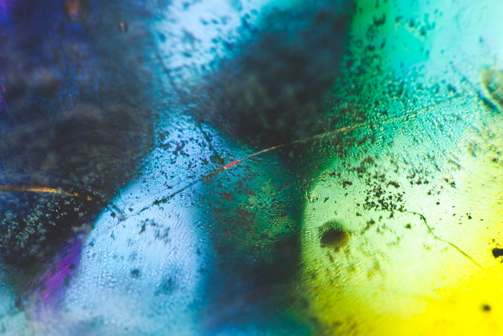 a close up of a rainbow colored substance