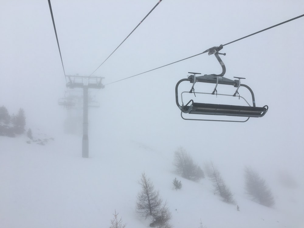 gray cable cars during foggy day