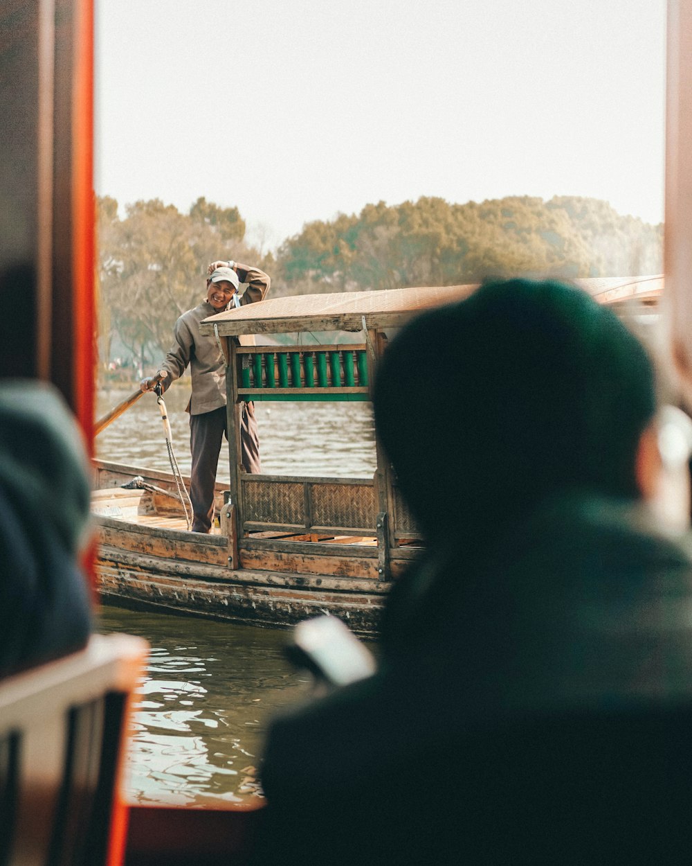 man on boat on body of water