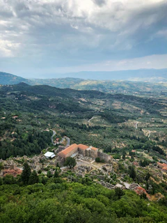 A panoramic view of the school building nestled in the lush hills of Desa Tanglad, Nusa Penida.