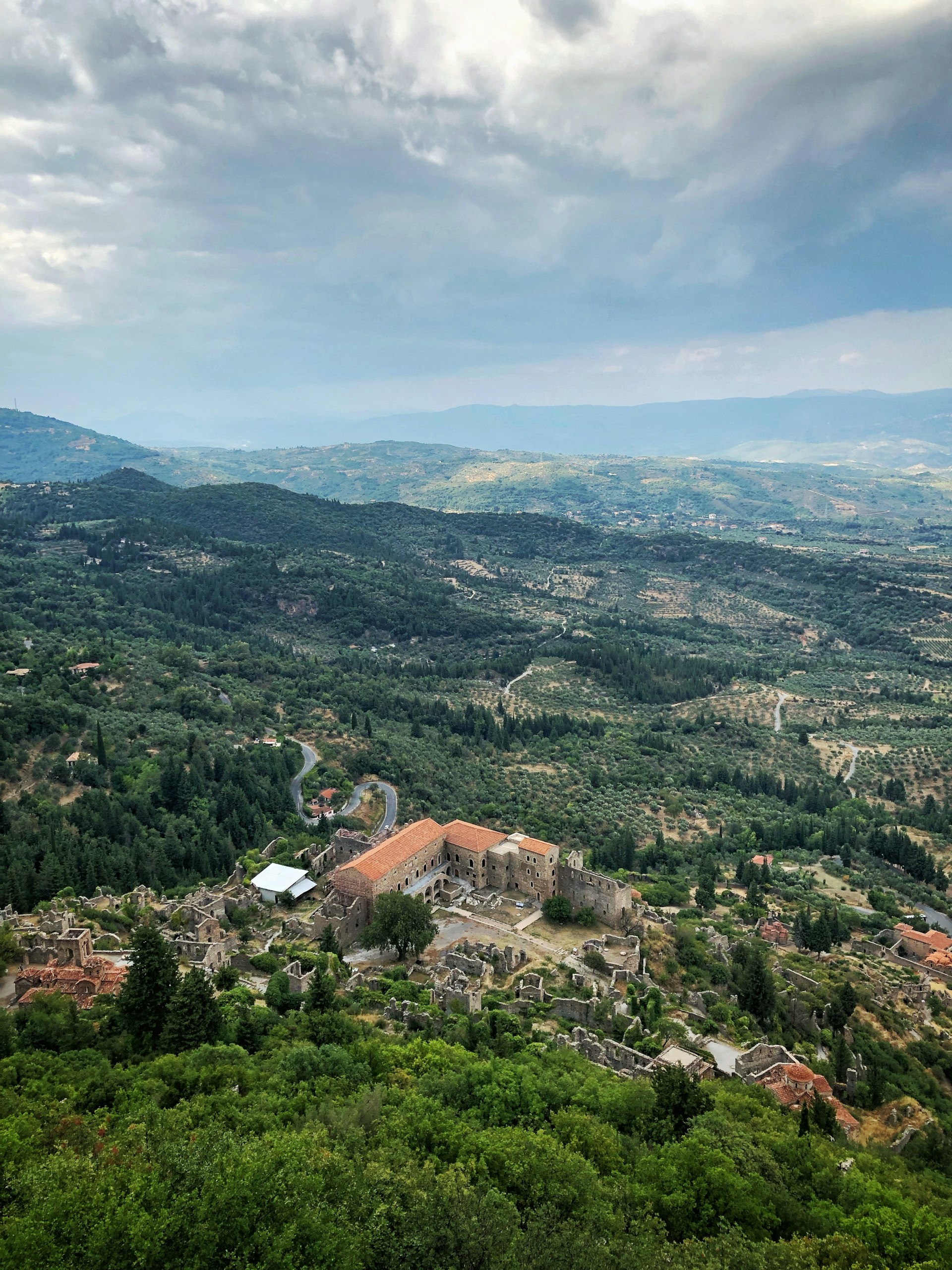 woman wearing yellow long-sleeved dress under white clouds and blue sky during daytime
