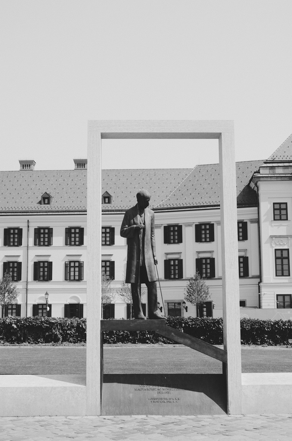 man wearing coat statue