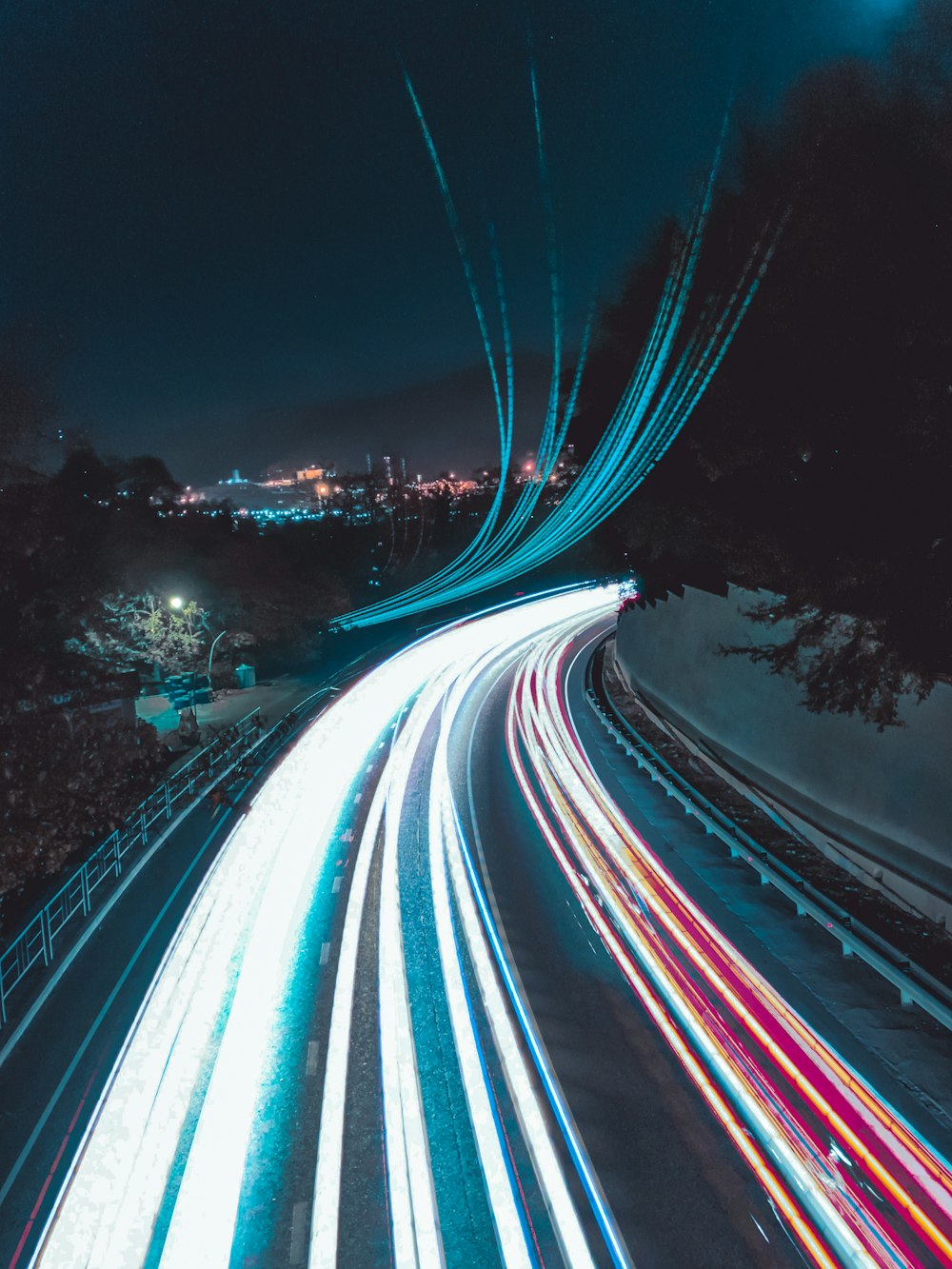 vehicle lights passing through highway