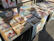 An array of colorful art prints arranged on a table.