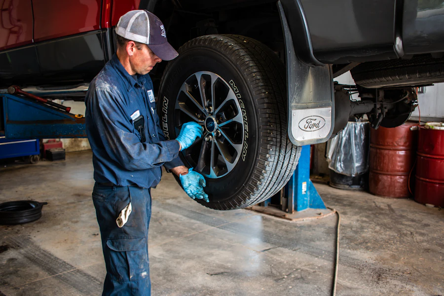 A technician working on a wheel