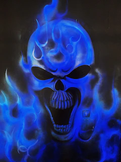 Close-up of a skull emblem with red flames on a black leather vest, highlighted against a dark background.