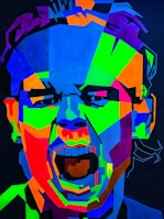 A colorful digital portrait blending abstract shapes with a smiling face.