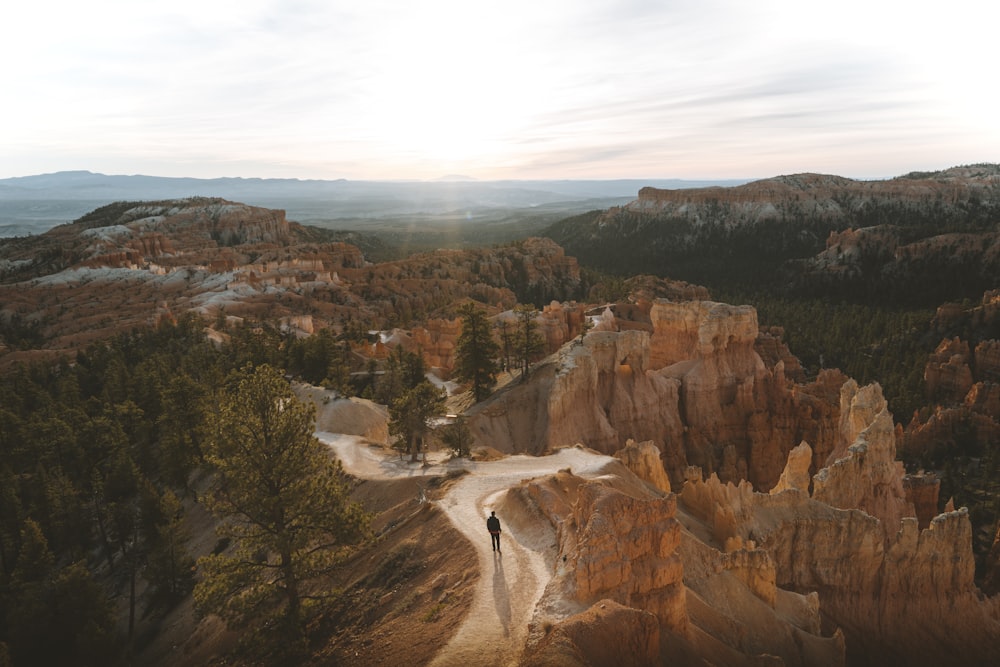 man standing on mountain